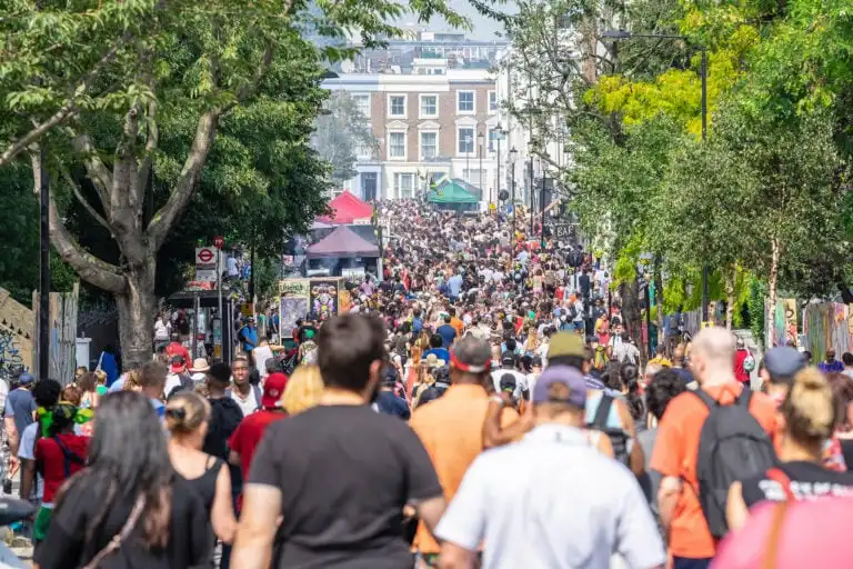 Crowd-walking-through-Nothing-Hill-Carnival-Festival-in-London