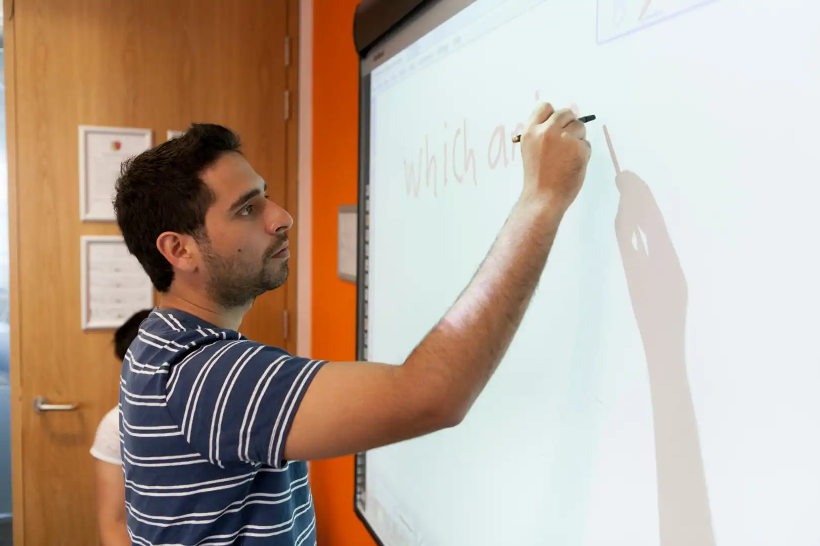 ec-brighton-language-school-teacher-writing-explanation